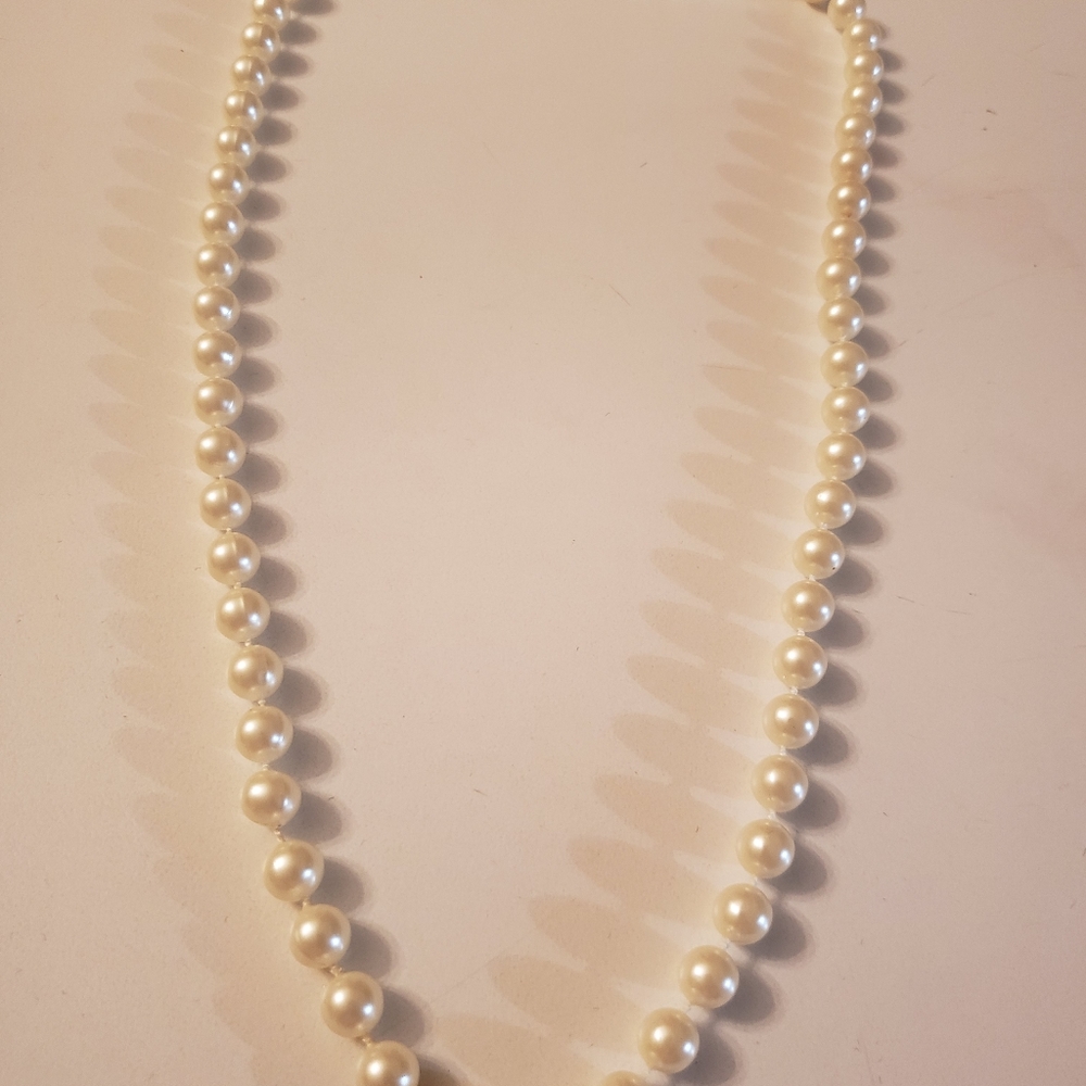No name off white beads.